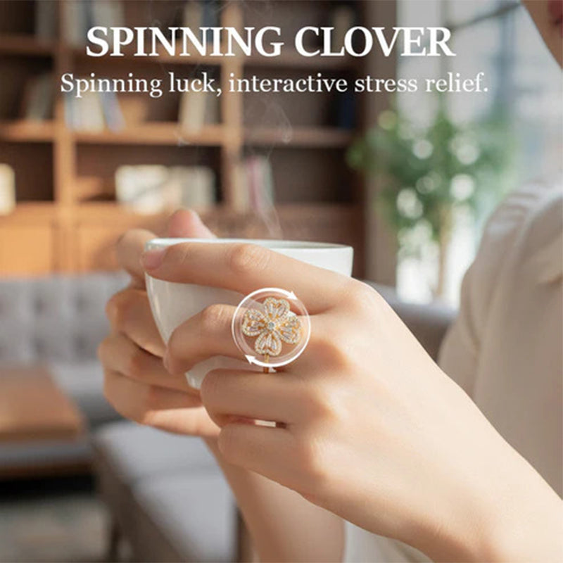 Spinning four-leaf clover ring