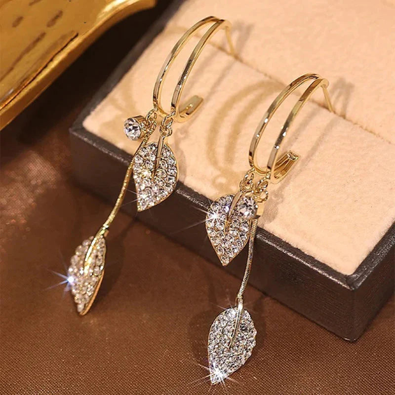 Diamond leaf tassel earrings