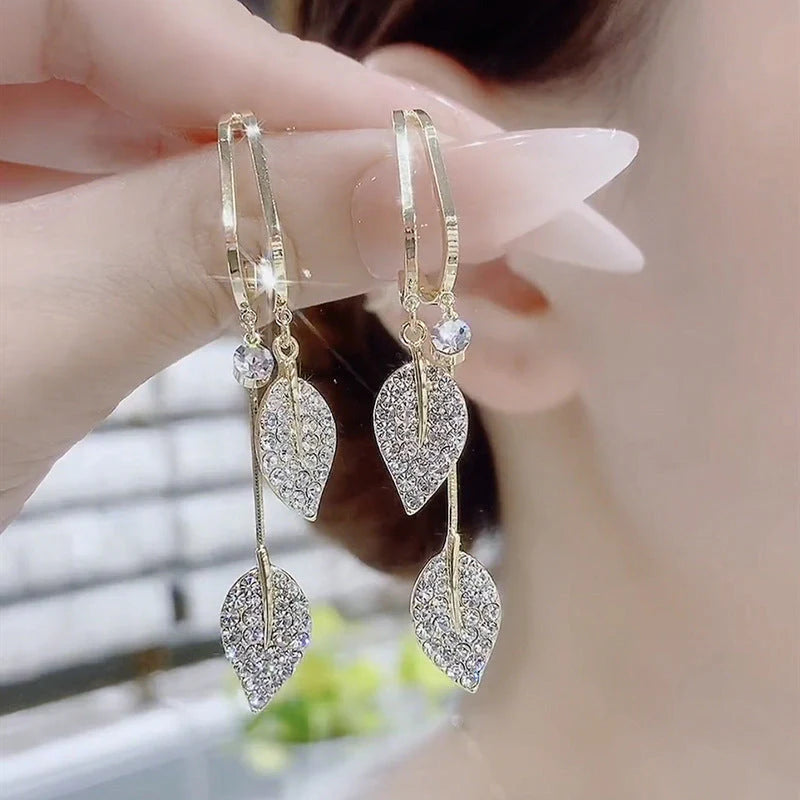 Diamond leaf tassel earrings